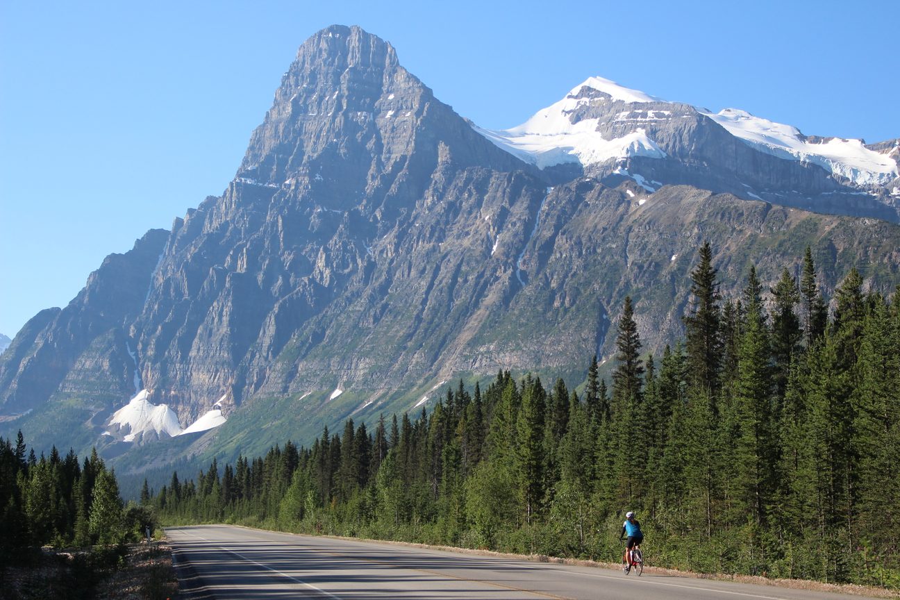 A lone cyclist on the Icefields Parkway below Mount Chephren