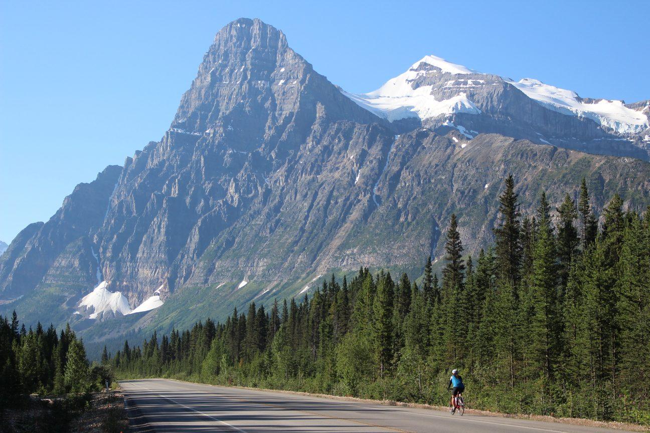 A lone cyclist on the Icefields Parkway below Mount Chephren