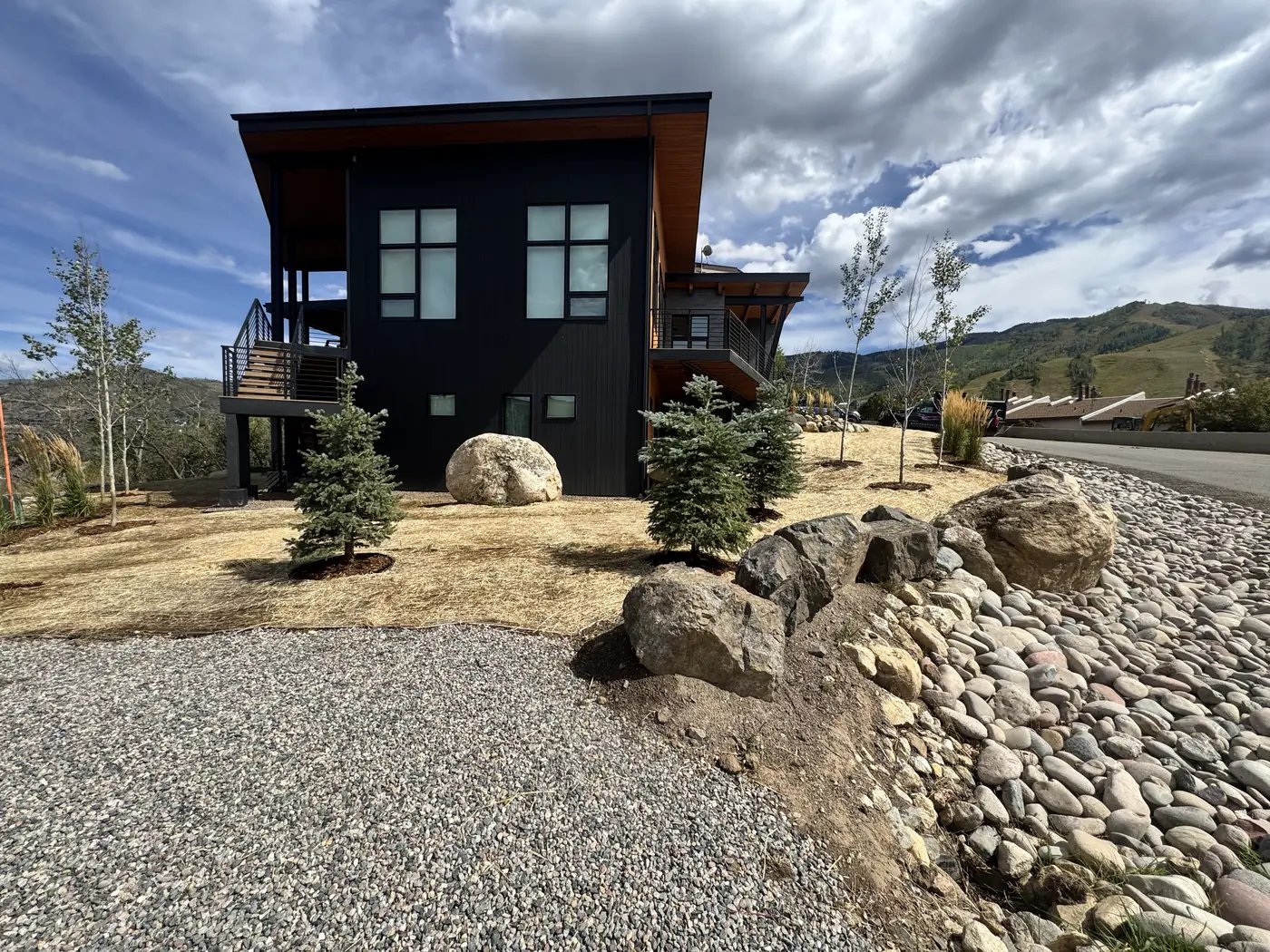 Decorative boulders and gravel in a residential landscape