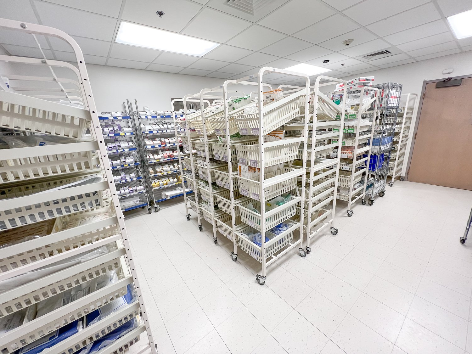 UNICAS installation team at work in a medical supply room