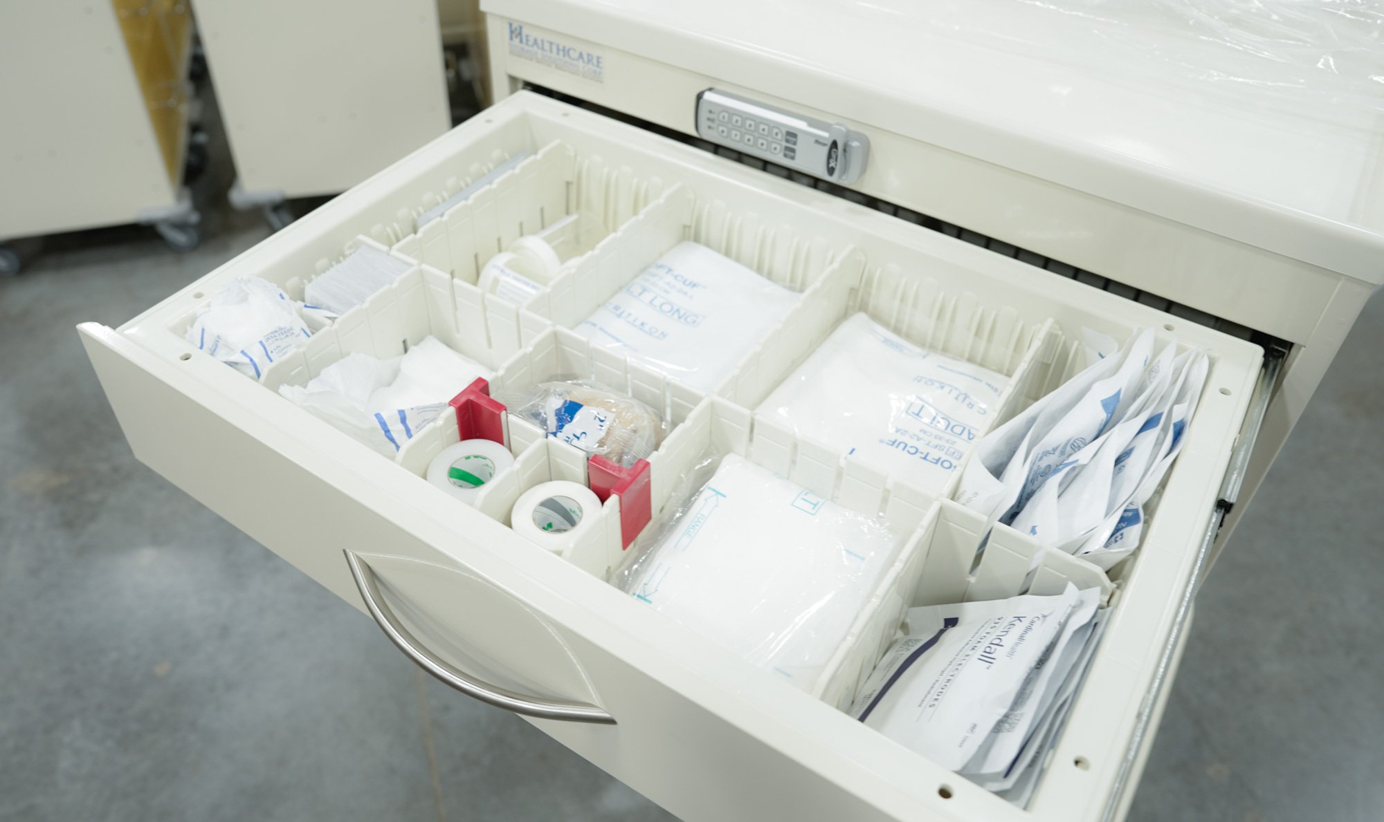 Organized two-compartment Kanban storage drawer in a UNICAS system