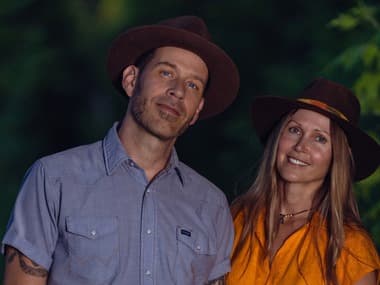 Scott Cook and Pamela Mae in front of a forest
